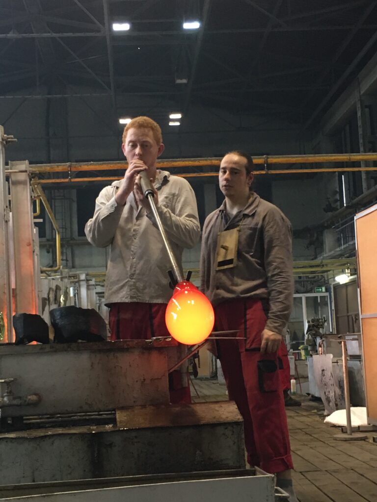 Glass blower in the factory